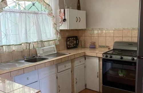 Grecia House | Charming 2-bedroom house with AC and WiFi in a quaint neighborhood.