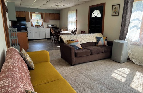 Irvine House | Charming 2-bedroom house in Tiona with sunset views and everything you need.