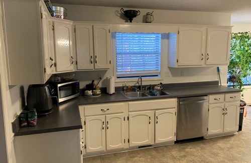 Marietta House | Charming 4-bedroom house with fireplace, sunroom, & massive back yard.