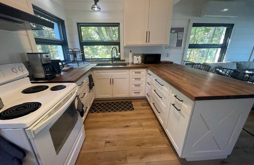 Lake Leelanau House | Charming beach house on Lake Leelanau. Includes kayaks and a fireplace.