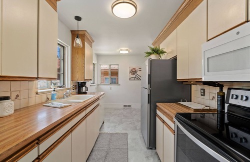Cheyenne House | Charming brick home in The Avenues just a few blocks to Frontier Park.