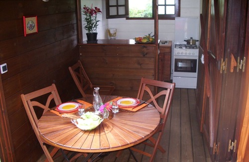 Maniron House | Charming exotic wood bungalow with pool in a tropical garden.