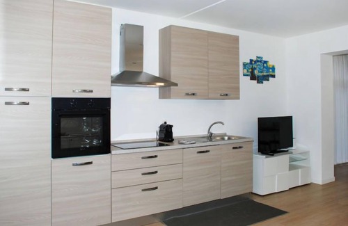Bissone Apartment | Charming Gardenview App. 105 by Interhome