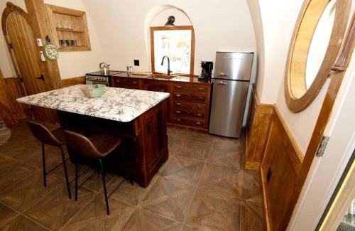 Springvale House | Charming Luxury Hobbit House with Private Hot Tub in Tranquil Woodlands on Littlefield Pond in Springvale, Maine