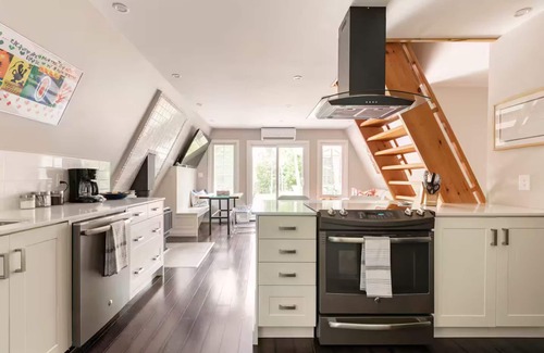 Grey Highlands Cabin | Charming updated A-frame home nestled in the woods adjacent to Kimberley Creek.