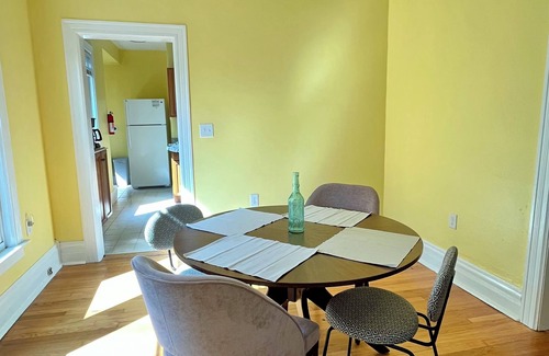 Ypsilanti Apartment | Cheerful 2BR apt, historic home near EMU and U-M, walkable area. Dog friendly!