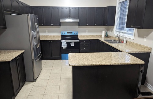 Alcona House | Cheerful 4 Bedroom house with indoor fireplace