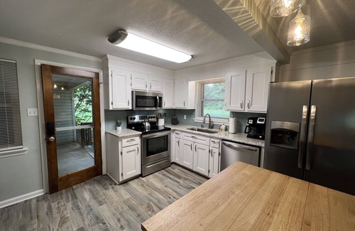 Newton House | Cheerful, relaxing ranch in quiet neighborhood with fire pit