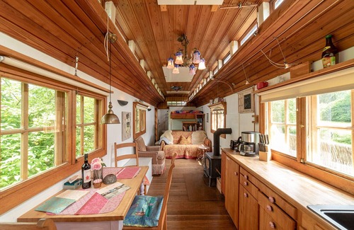 Windeck House | Circus wagon by the river