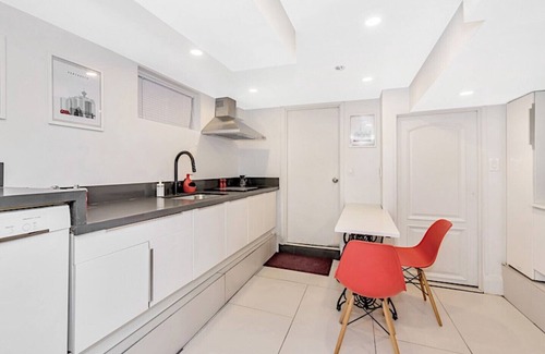 East Danforth House | Clean, white, bright and close to Woodbine subway
