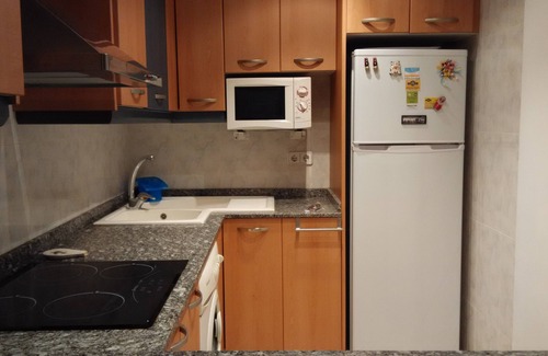 Comarruga Apartment | Comfortable apartment, Wi-Fi A/C and pool.