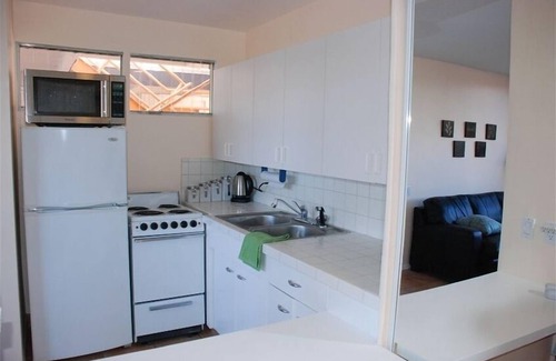 Twin Palms Apartment | Comfortable Ground Floor Apartment in Historic Ocotillo Lodge with private patio