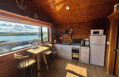 Malin Cabin | Cosy Portmor Log Cabin - Waterfront & Pet Friendly