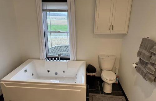 Fairview Highland County Apartment | Country Cornerstone Retreat Upstairs Apartment with Hot Tub, Jetted Tub, Sauna, Massage Chair, BBQ