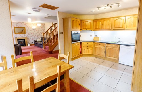 Tomich Cottage | Courtyard Cottage seasonal pool, wi fi, sleeps 6 guests in 2 bedrooms + sofa bed
