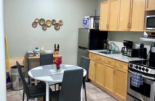 Northwest Edmonton House | Cozy 2 bedroom basement with 2 beds, kitchen, 75’ TV and bathroom