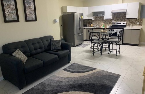New Kingston Apartment | Cozy 2bedroom condo with 24/7 security, free Wi-Fi, and free Parking.