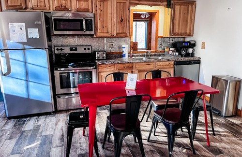 Butler Cabin | Cozy 2BR/2BA cabin tucked in the trees with hot tub, fire pit, covered deck, and fast WiFi.