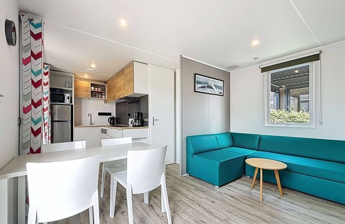Jullouville-les-Pins House | Cozy 2BR Mobile Home, Pool, 200m from Beach, 4 Guests, Parking, Fitness & More!