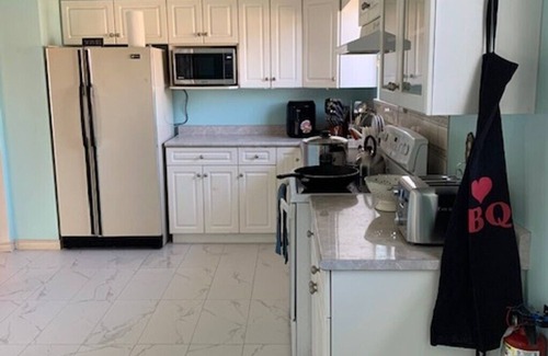 Kensington-Cedar Cottage House | Cozy and cheerful 4-bedroom home with free parking on premises