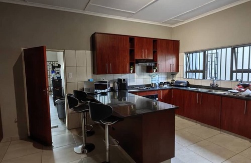 Matsapha House | Cozy bedroom ensuite, fully equipped retreat.