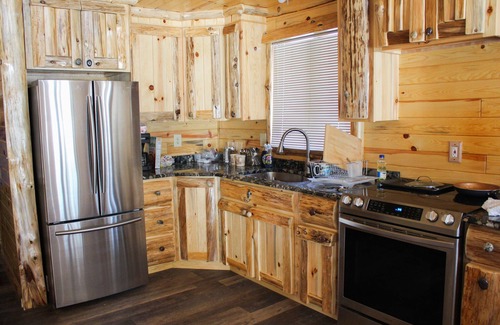 Au Gres Cabin | Cozy Cabin in the Woods- close access, private road to dock & Lake Huron access.