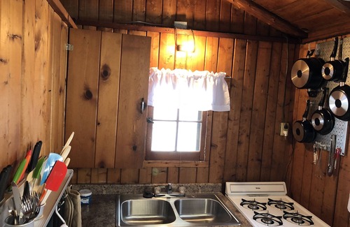 Pentwater Cabin | Cozy "Sailing" Cabin in the woods with Pentwater Lake frontage and access