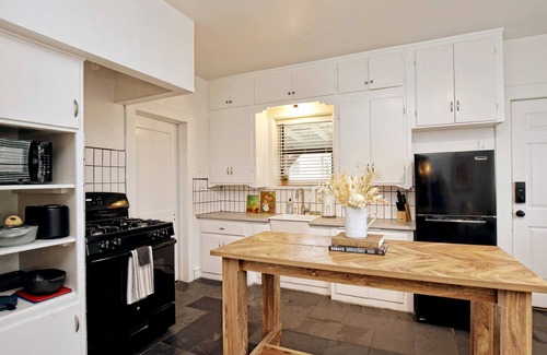 Austin Ave. House | Cozy Tudor Bungalow in Waco