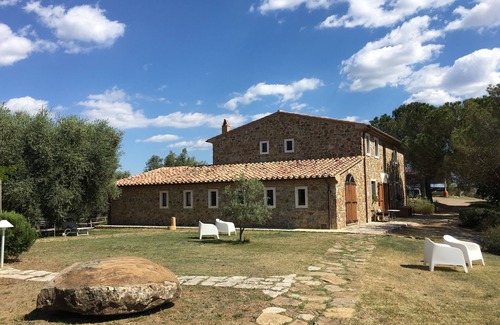Manciano House | Cozy tuscan casale in stone and wood on a top of hill covered with olive trees