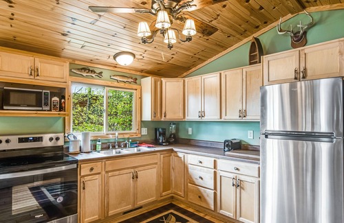 Lac du Flambeau House | Cozy Waterfront Cabin with Deck, Boat Dock, Kayak & Fire Pit
