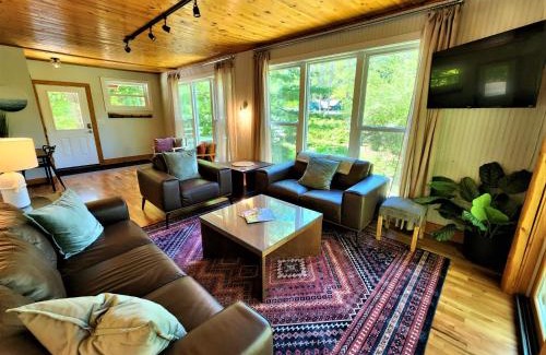 Traverse City House | Creekside Hot Tub-Walk to Beach-Uniquely Northern