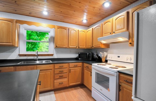Paris House | Crystal Rapids Retreat: Cozy Up to Autumn's Beauty on the Muskegon River.