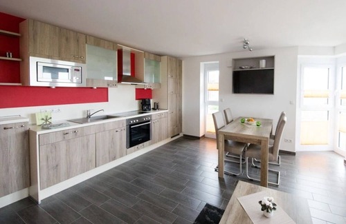 Wurster Nordseekuste Apartment | "De Kohbloom" - Relax on the North Sea in cozy dike proximity with balcony!