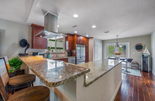 Anna Maria House | Decked Out - Stunning Home Huge Sunny Resort Style Heated Pool Walk to Pine Ave Beach