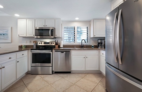 New Smyrna Beach Condo | Direct oceanfront corner condo with large wrap-around balcony and heated pool