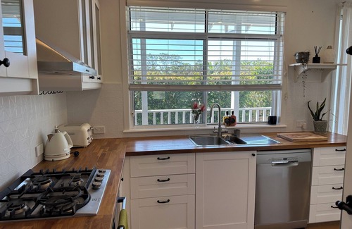 Arrawarra Headland Apartment | Dog friendly apartment close to beaches. Own private yard, garden and 2 decks.