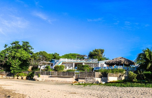 Treasure Beach Villa | Doubloon Villa, large pool and sandy beach at heart of Treasure Beach