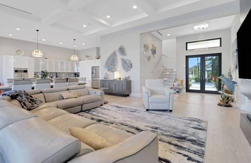 Pelican House | Dream Home Vacation! Stunning Waterfront! Luxurious Resort-Style Lagoon Pool, Spa & Outdoor Living!