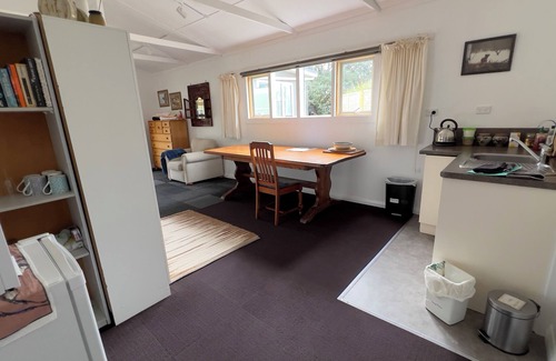 Opunake Cottage | Eco retreat, easy stroll to beach. Organic garden setting