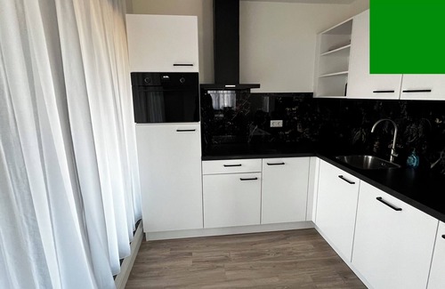 Goirle Apartment | Elegant stay with parking, WiFi, and contemporary furnishings near local shops. Sleeps four