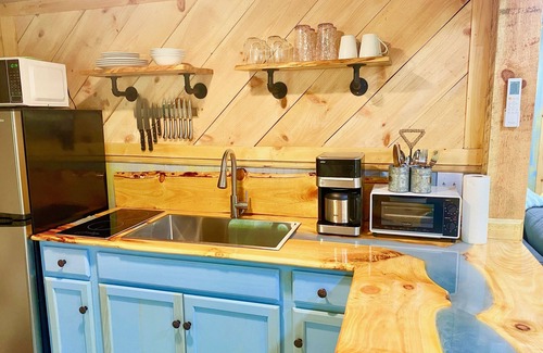 Piper Gap Cabin | Elevated eclectic yurt with wrap-around porch, hot tub, and mountain view!