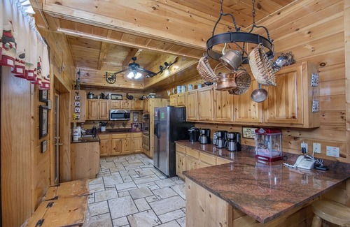 Pigeon Forge Cabin | Ern854 - Wagon Wheel Lodge - Great Location! Close To All The Action! 9 Bedroom Cabin by RedAwning