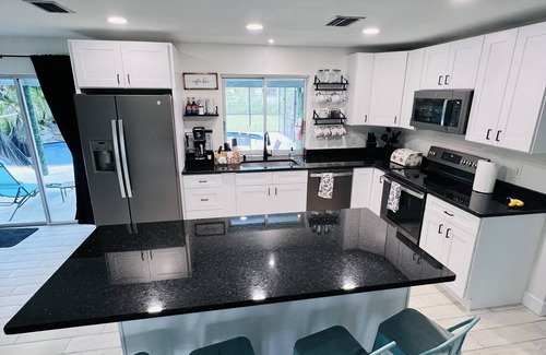Fort Myers Shores House | Escape to Sunshine Bliss: Unwind in our Stunning Retreat! With heated pool!