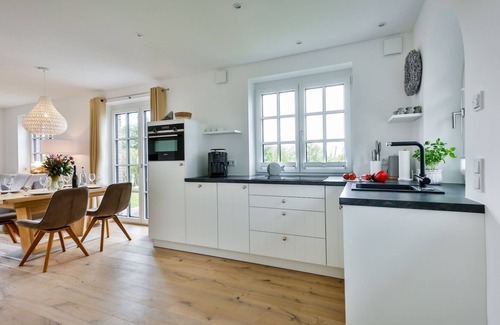 Tinnum House | Exclusive new-build house with garden and wonderful salt marsh views. -