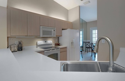 Pelican Bay Condo | Exclusive Pelican Bay, 2 BR + Den with Garage, 2nd Floor Unit in Barrington Club