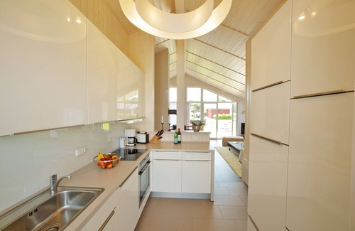 Wesselburenerkoog House | Exclusive wooden house with high sense right on the North Sea dike