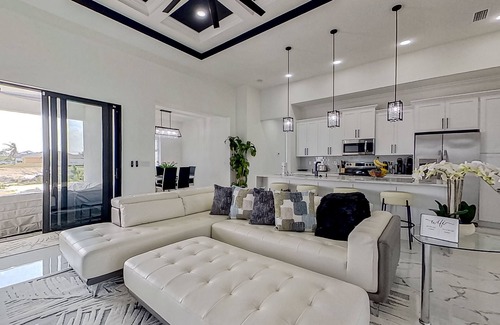 Diplomat House | Exquisite riverfront home with pool, lanai, fireplace, W/D, 7 dog-friendly