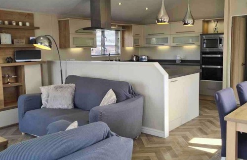 Dogdyke Cabin | Fable Lodge - Luxury lakeside lodge with sunken hot tub at Tattershall Lakes