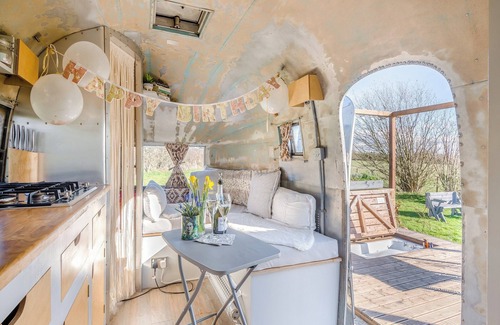 Hereford Cottage | Fabulous Airstream with sunken bath in the decking, perfect for that romantic break away.