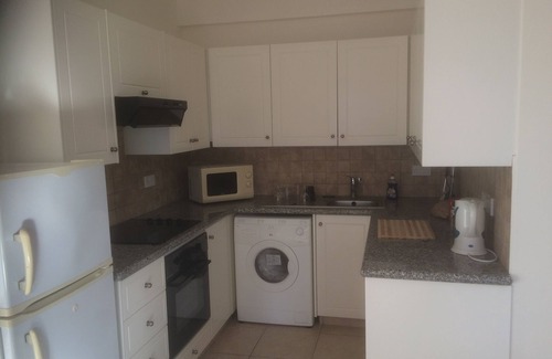 Paphos Apartment | Fabulous Roof Terrace near Tombs of the Kings on small complex with pool